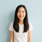 Smiling young woman in t-shirt